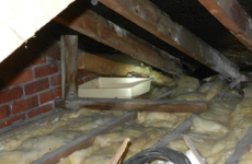 Attic space with bowls to catch drips